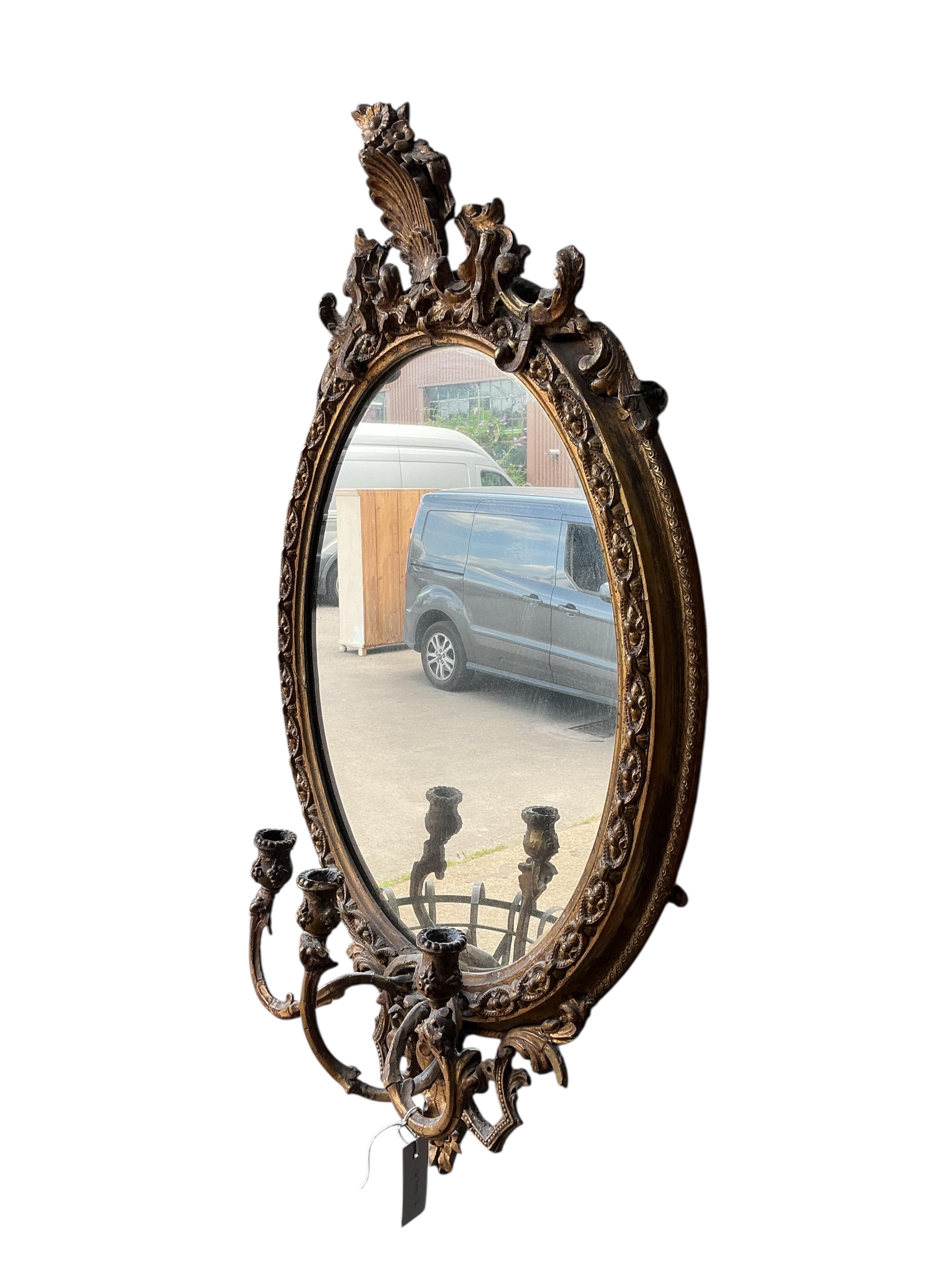 A Victorian giltwood and composition girandole wall mirror, width 56cm, height 96cm